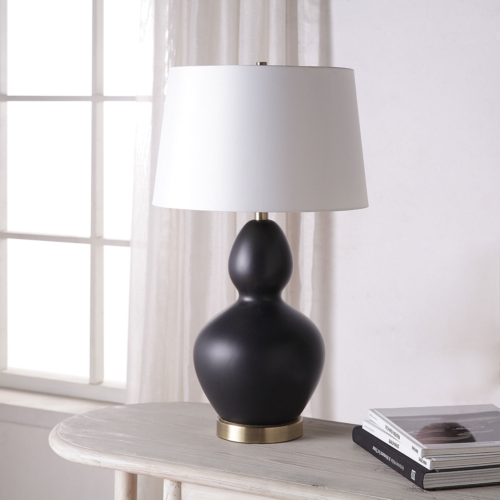 Kamilia Table Lamp Set featuring a matte black ceramic base and white tapered shade.