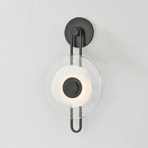 Close-up of the Keuka Park Wall Sconce in bronze showing the arm curve and shade silhouette.