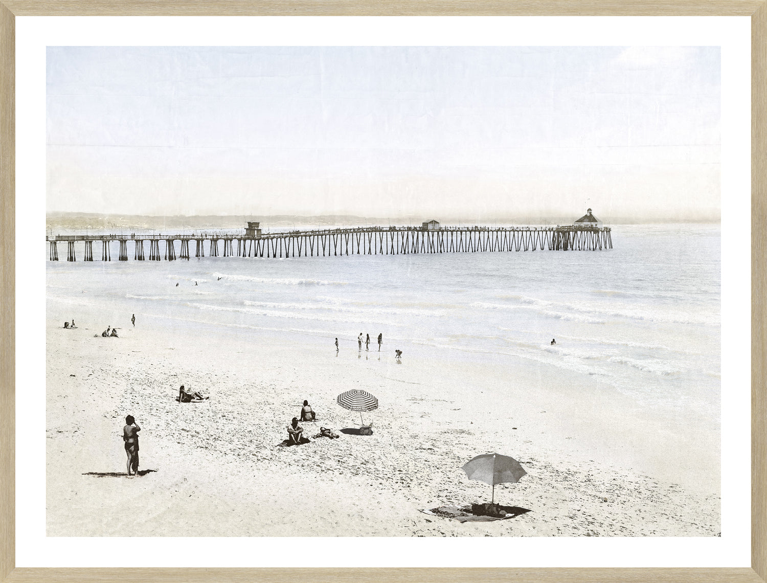 Imperial Beach CA wall art featuring a serene beach scene with a pier, soft colors, and people relaxing.