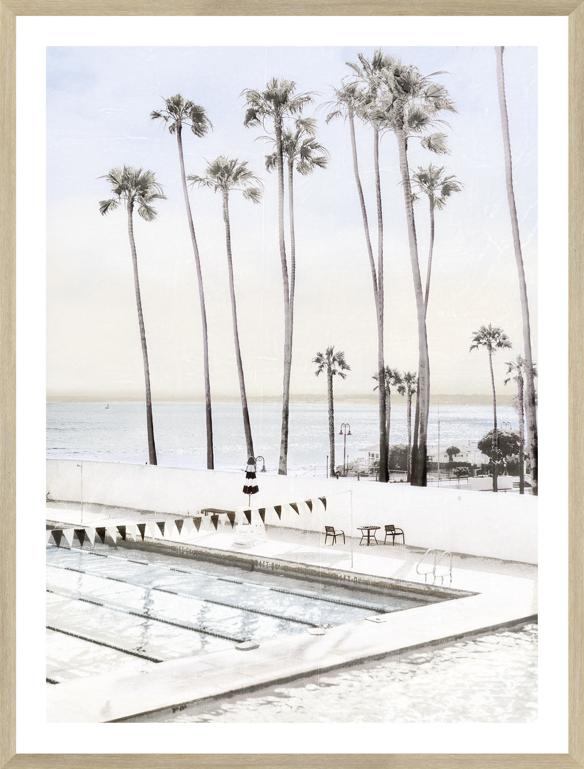 Ole Hanson Beach Club wall art featuring palm trees and a swimming pool near the ocean