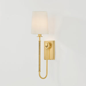Close-up of the Glenmont Wall Sconce 5.25" in aged brass showing the arm curve and shade silhouette.