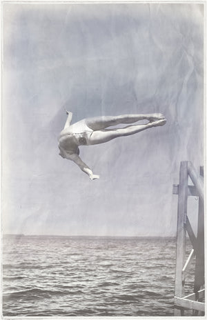 Indigo Stained – Mid Dive, a vintage-style wall art featuring a diver mid-air above water, in a faded blue and gray color palette.