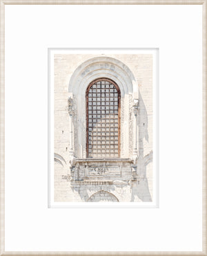 Masonry – Apulia, Italy wall art featuring a detailed arched window with a wooden grid.