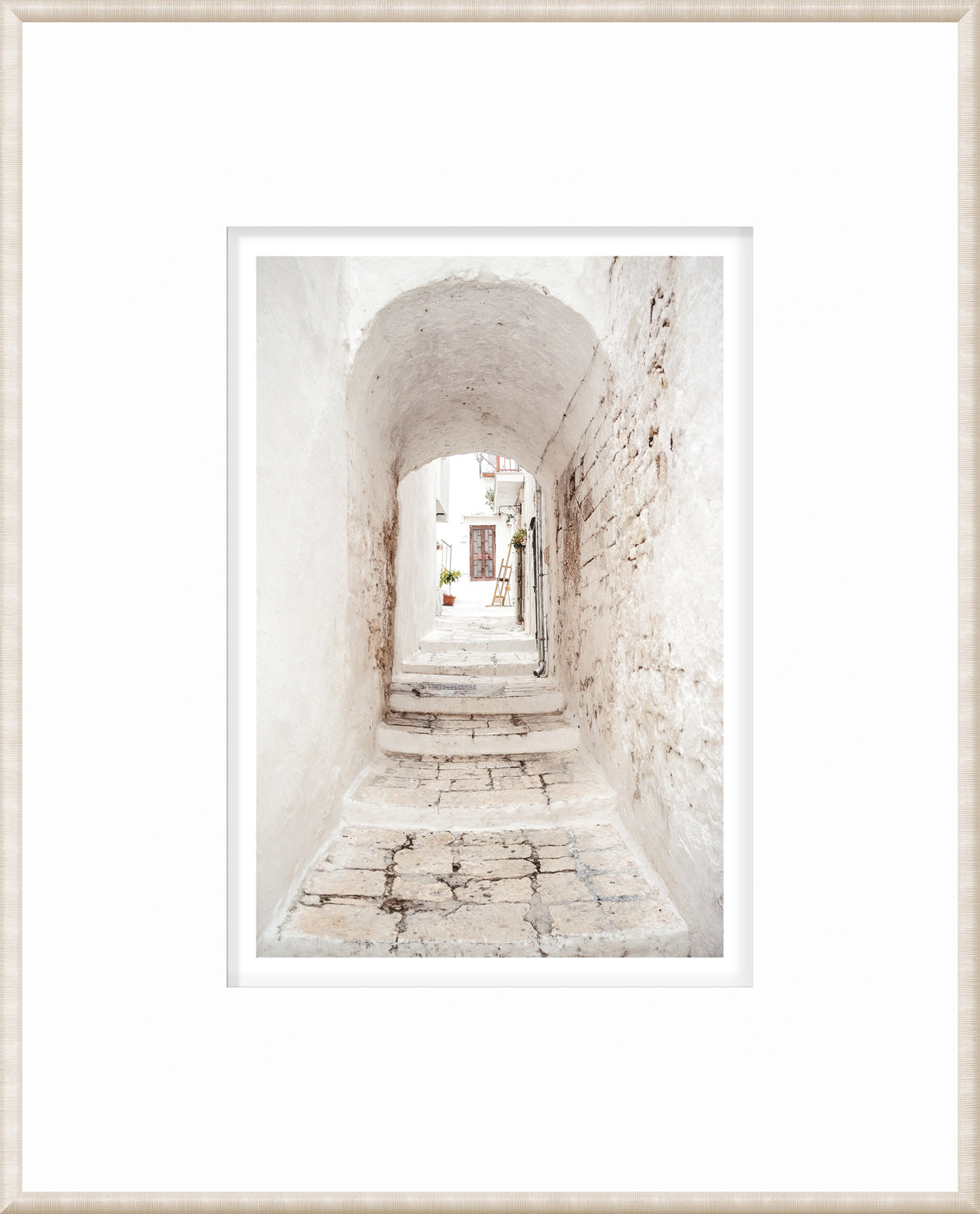 Masonry – Ostuni, Italy wall art featuring a narrow white stone alleyway with steps.