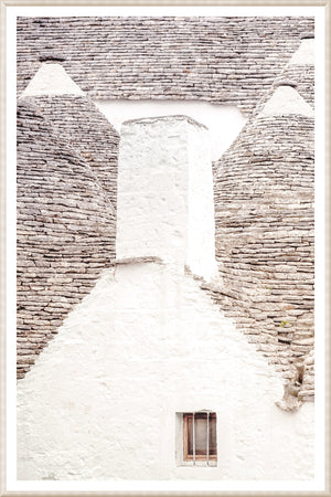 Masonry – Trullo Rooftops wall art featuring white stone structure with gray stone rooftops.