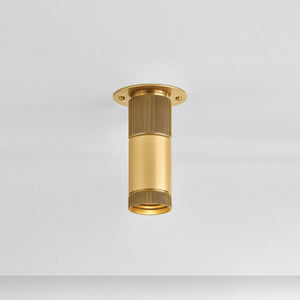 Dighton Flush Mount in aged brass shown from the front to reveal the shade profile and mounting canopy.