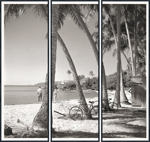 Nostalgia Collection – At the Beach C. 1959, black and white triptych of beach scene with palm trees and figures walking.