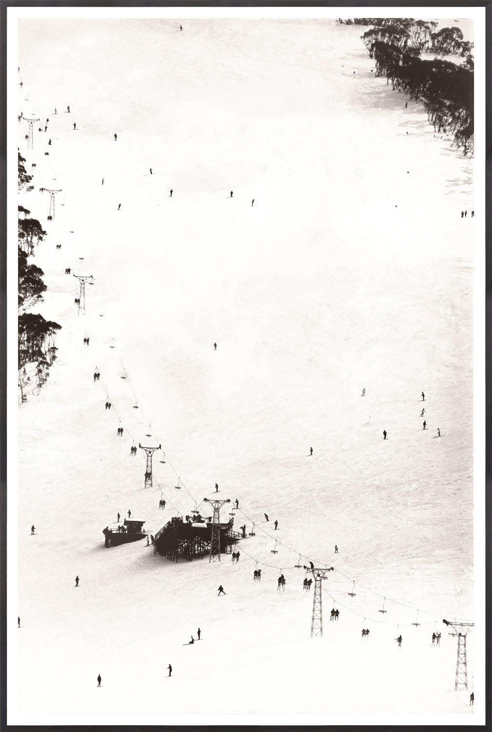 Ski Lift C. 1966 wall art featuring a black and white aerial view of skiers and ski lifts on snow.