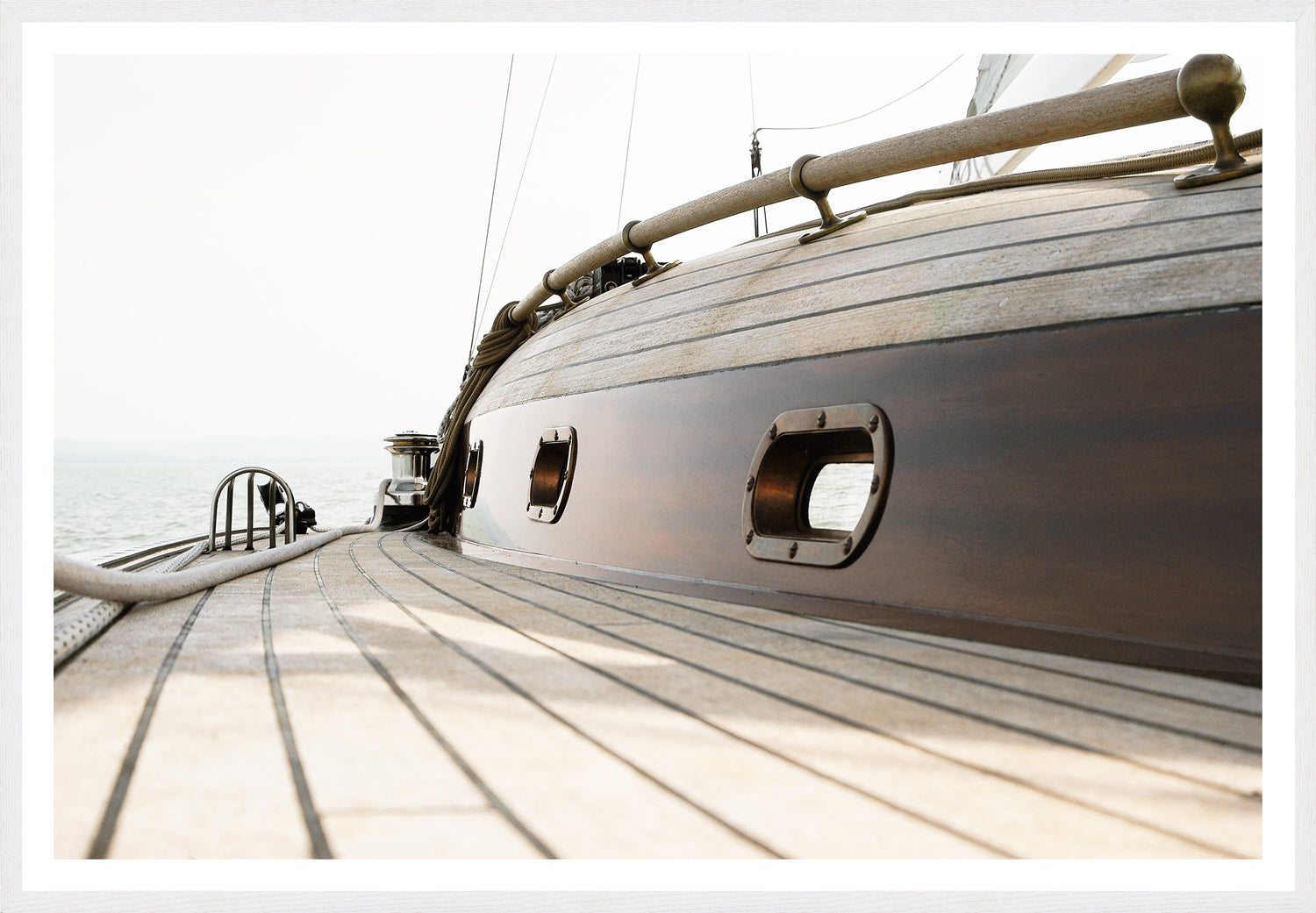 Sailing Details II wall art featuring a close-up view of a wooden sailboat deck with polished wood and metal details.