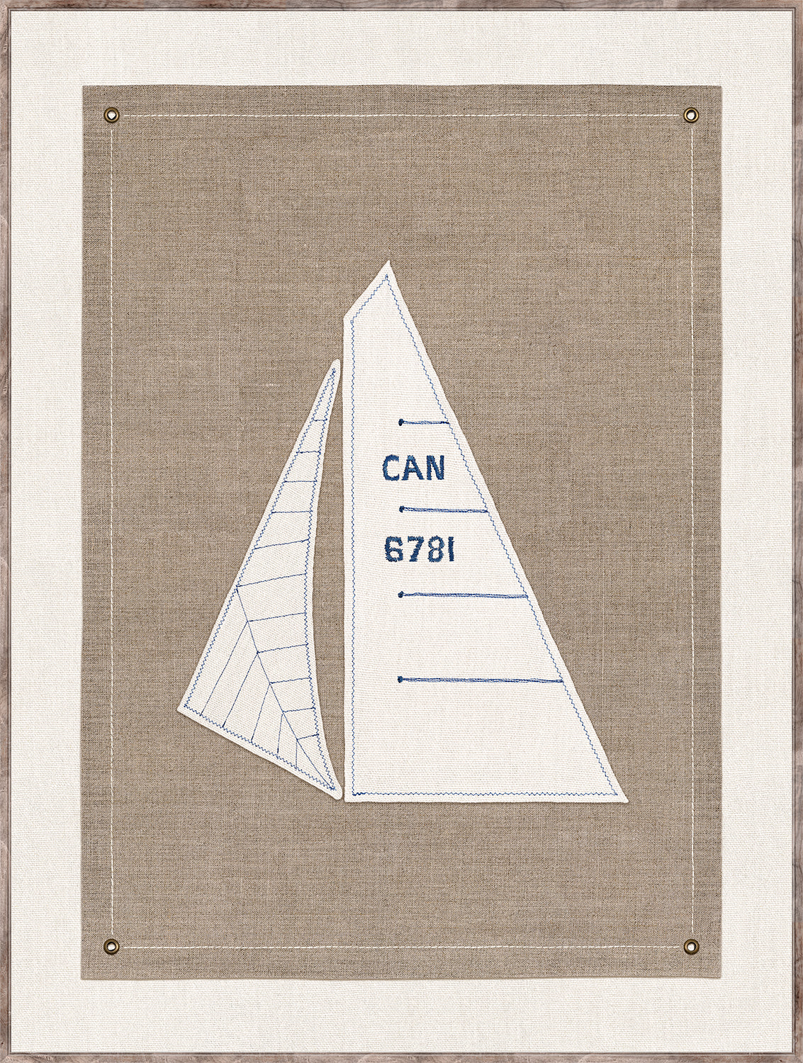 Set Sail III wall art featuring embroidered sailboat design on beige fabric with blue stitching and brass grommets.