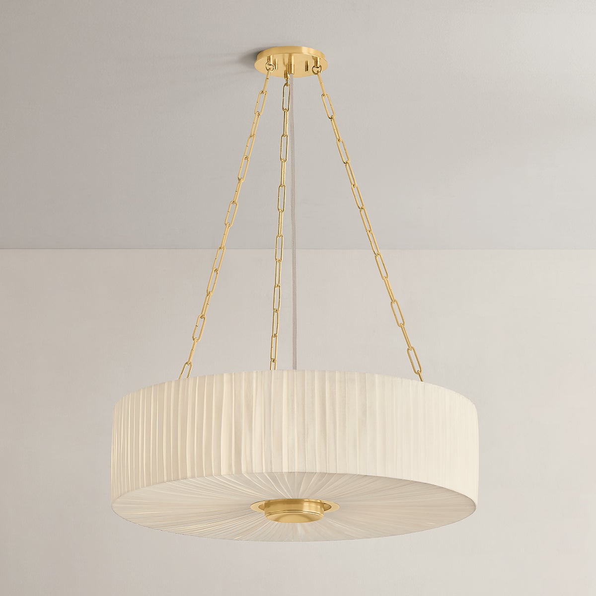 Close-up of the Camby Chandelier in aged brass showing the frame, arms, and shade detail.