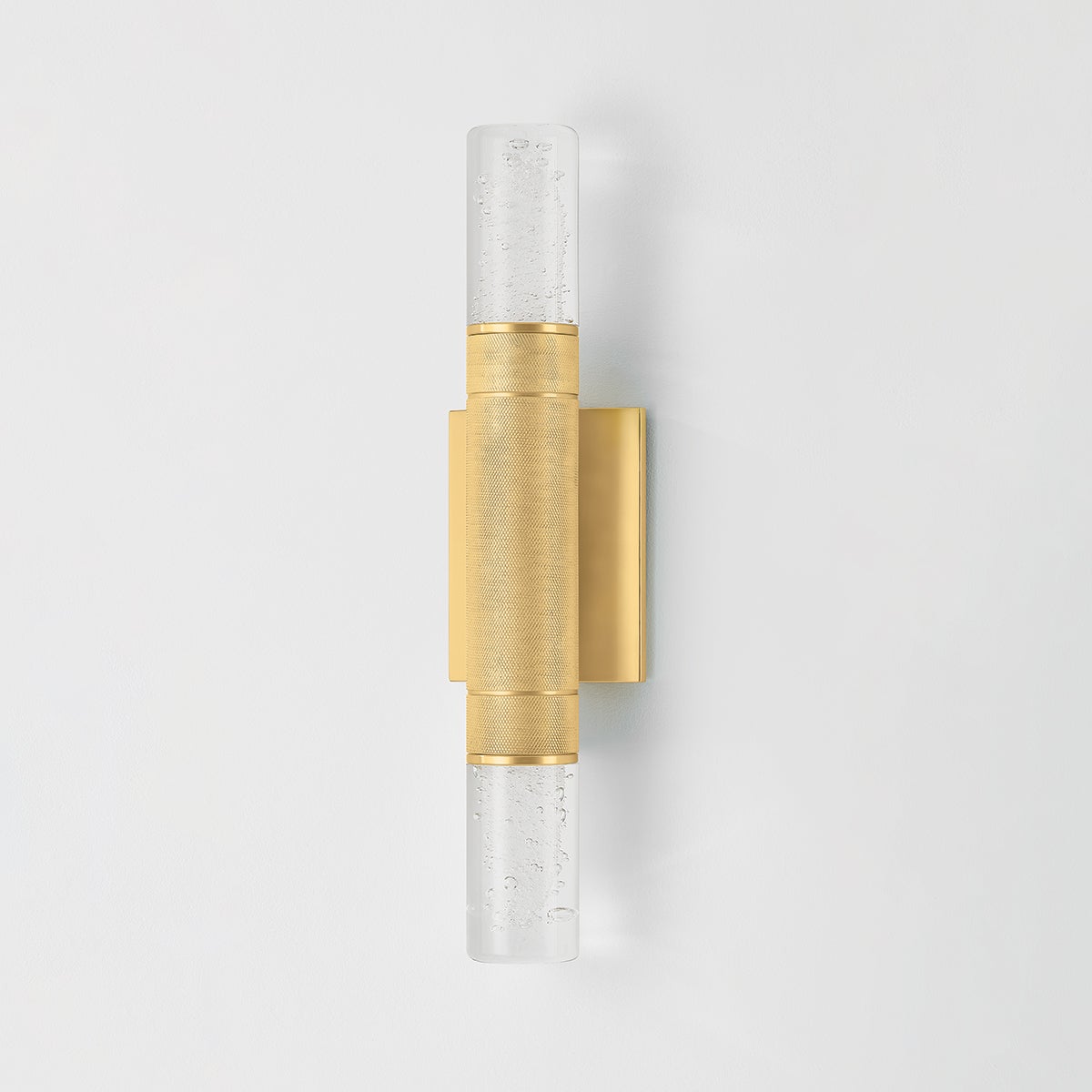 Glen Cove Wall Sconce in aged brass shown from a second angle to highlight the arm curve and shade silhouette.