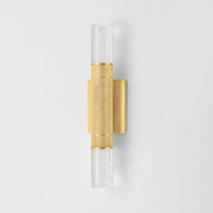 Glen Cove Wall Sconce in aged brass shown from a second angle to highlight the arm curve and shade silhouette.