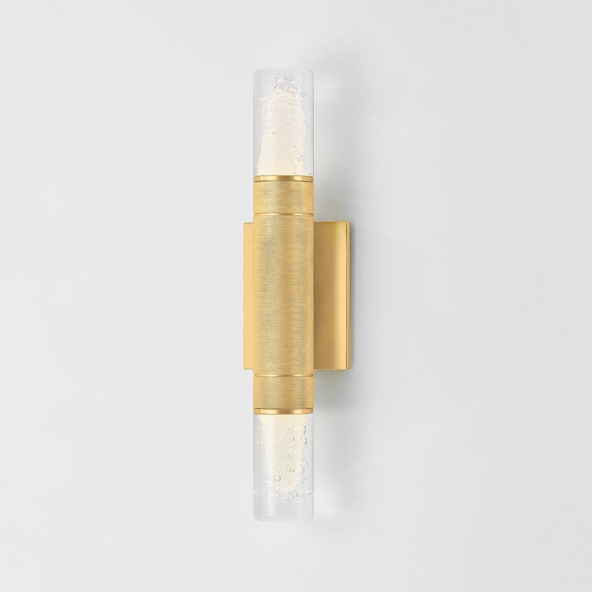 Glen Cove Wall Sconce in aged brass shown from the front to reveal the arm curve and shade silhouette.