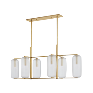 Pebble Linear in aged brass — a Hudson Valley linear for dining rooms, kitchen islands, and long consoles at Laurie Yapp Home.