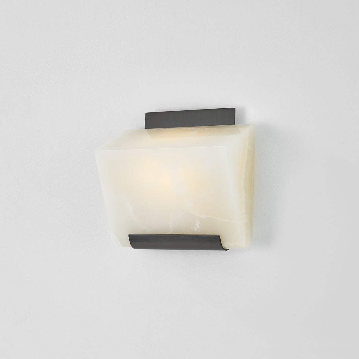 Close-up of the Fairfield Wall Sconce in bronze showing the arm curve and shade silhouette.