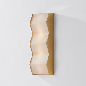 Close-up of the Tanzanite Wall Sconce showing the arm curve and shade silhouette.