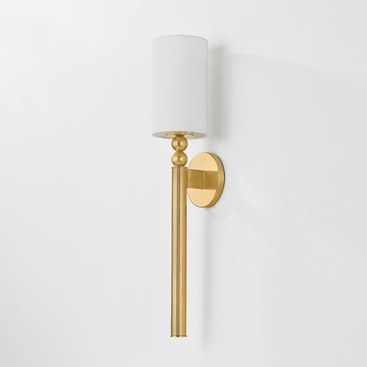 Close-up of the Lakeport Wall Sconce in aged brass showing the arm curve and shade silhouette.