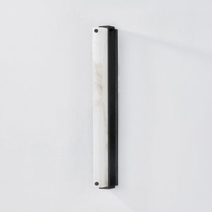Close-up of the Edgemere Wall Sconce in dark bronze showing the arm curve and shade silhouette.