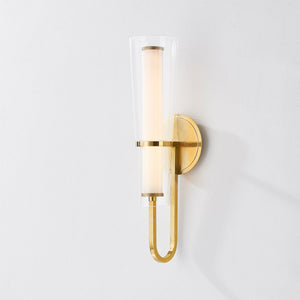Close-up of the Vancouver Wall Sconce in aged brass showing the arm curve and shade silhouette.