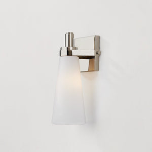 Close-up of the Trude Wall Sconce in polished nickel showing the arm curve and shade silhouette.