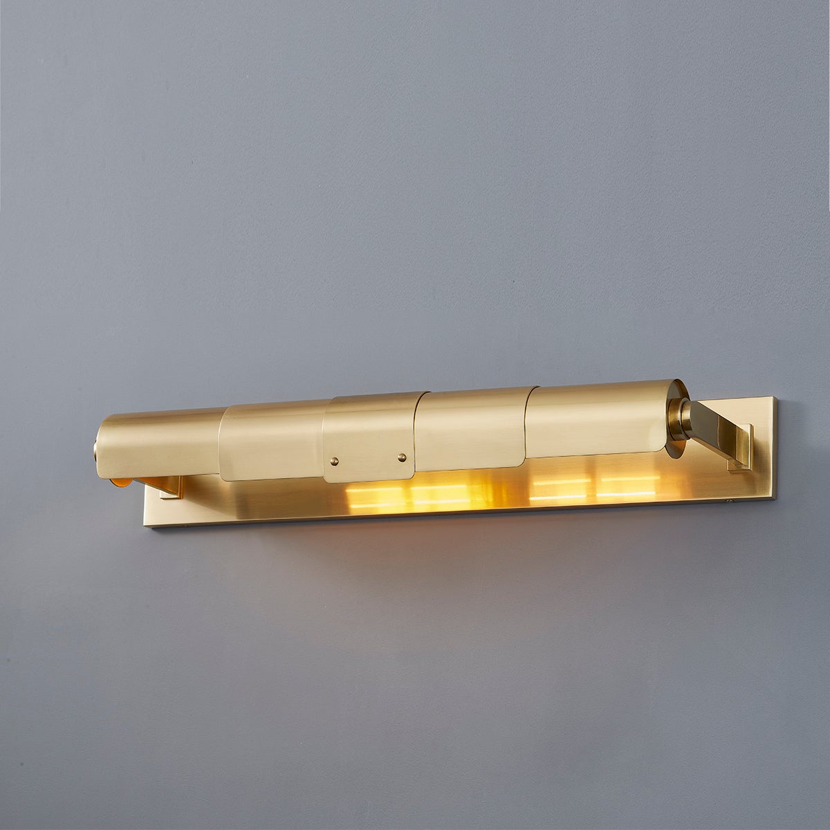 Close-up of the Oneonta Picture Light 24" in aged brass showing the arm curve and shade proportion.