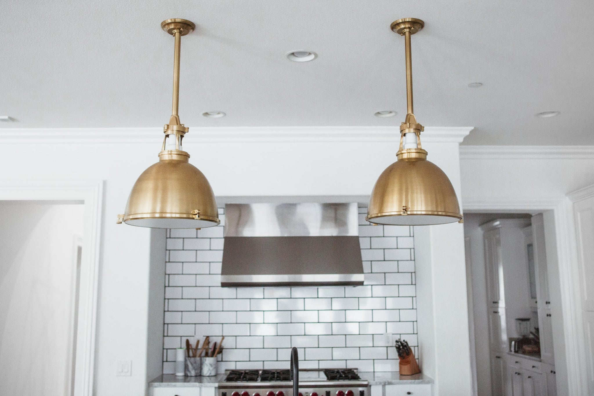 Massena Pendant 19.5" in aged brass shown from the front to reveal the shade shape and metal detail.