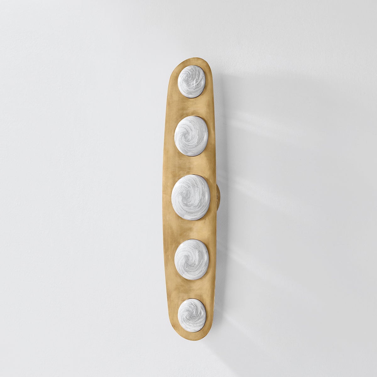 Close-up of the Bezel Wall Sconce 7" x 30.5" showing the arm curve and shade silhouette.