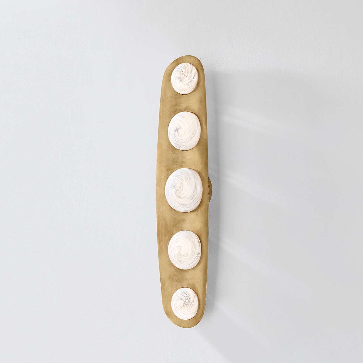 Close-up of the Bezel Wall Sconce 7" x 30.5" showing the arm curve and shade silhouette.