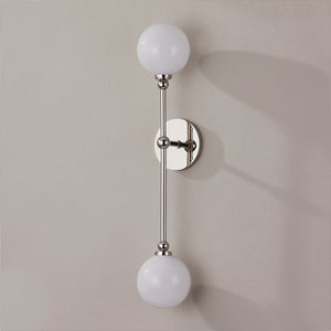 Close-up of the Andrews Wall Sconce in polished nickel showing the arm curve and shade silhouette.