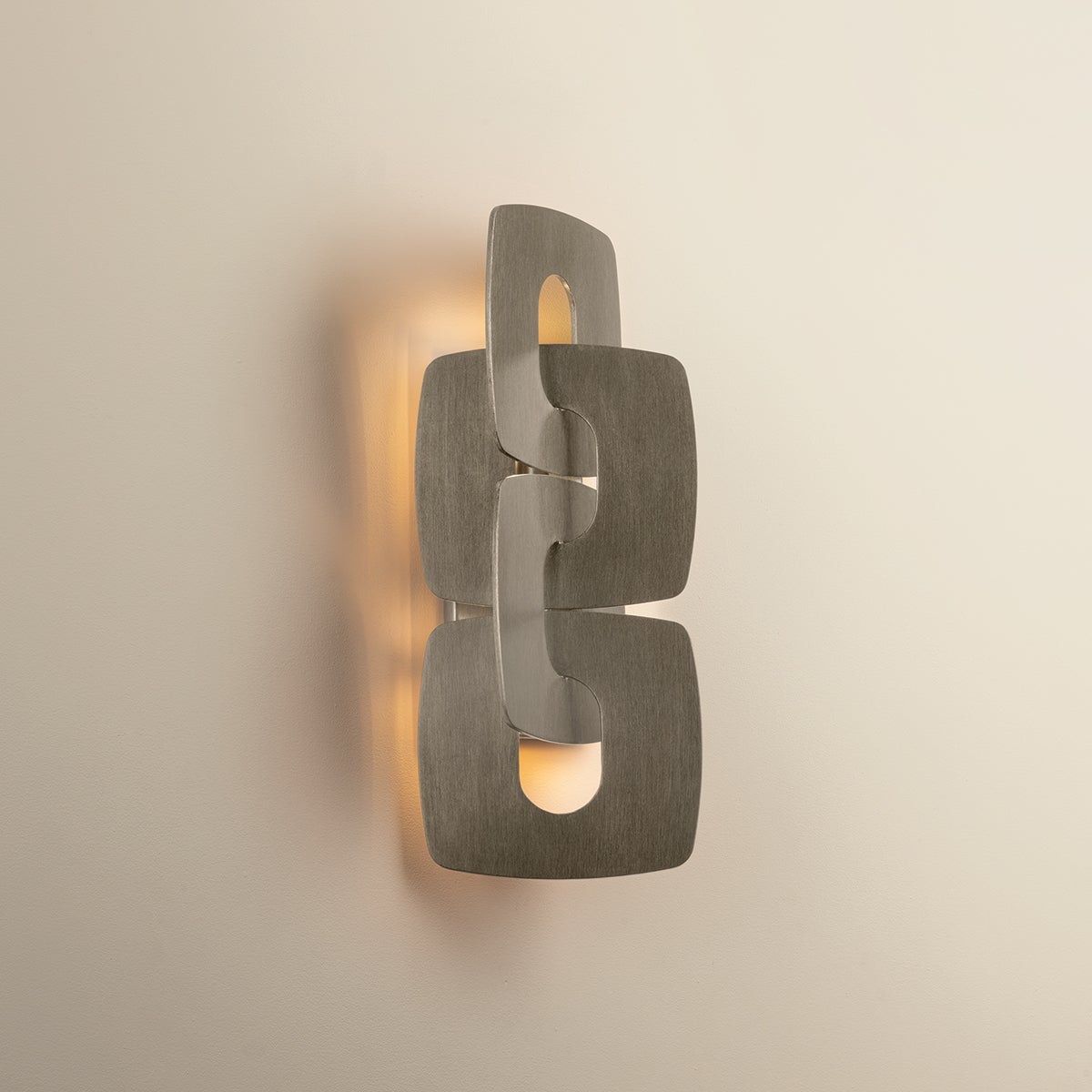Close-up of the Trentino Wall Sconce showing the arm curve and shade silhouette.