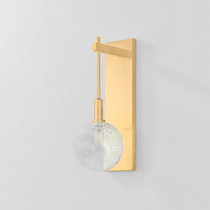Close-up of the Onteora Wall Sconce in aged brass showing the arm curve and shade silhouette.