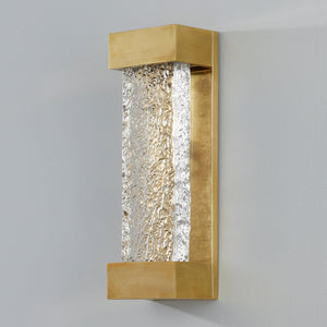 Wharton Wall Sconce 5" x 15" in aged brass shown from the front to reveal the arm curve and shade silhouette.