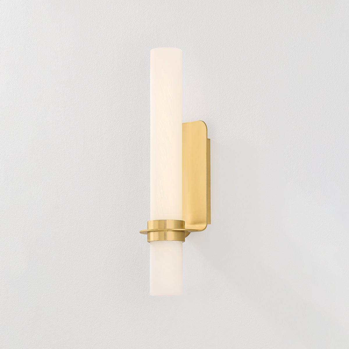 Groveland Station Wall Sconce 4.75" x 18" in aged brass shown from the front to reveal the arm curve and shade silhouette.