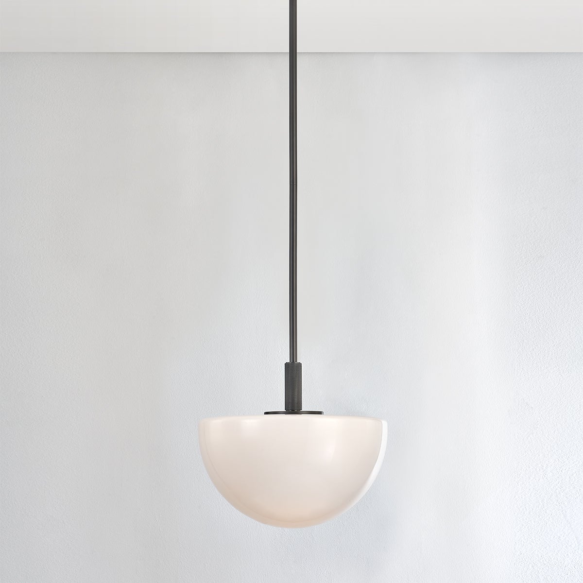 Close-up of the Lethbridge Pendant 15" in bronze showing the shade shape and metal detail.