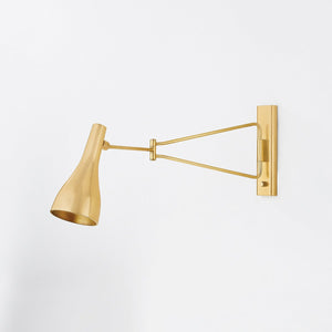 Northford Wall Sconce in aged brass shown from the front to reveal the arm curve and shade silhouette.