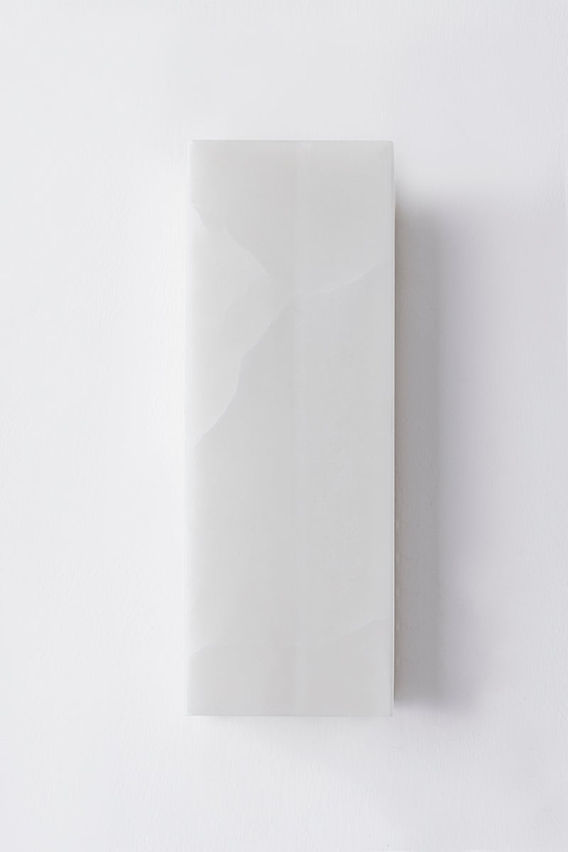 Bremsen Wall Sconce 5" x 13.5" in aged brass shown from a second angle to highlight the arm curve and shade silhouette.