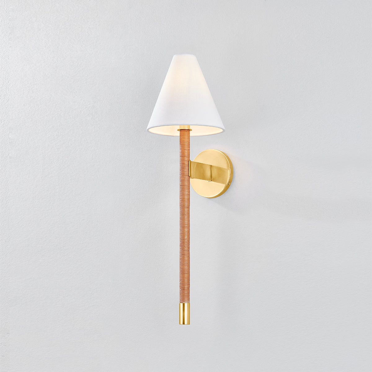 Close-up of the Watkins Wall Sconce in aged brass showing the arm curve and shade silhouette.