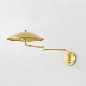 Brockville Wall Sconce in aged brass shown from a second angle to highlight the arm curve and shade silhouette.