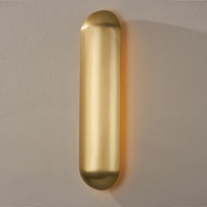 Close-up of the Wheeler Wall Sconce in aged brass showing the arm curve and shade silhouette.