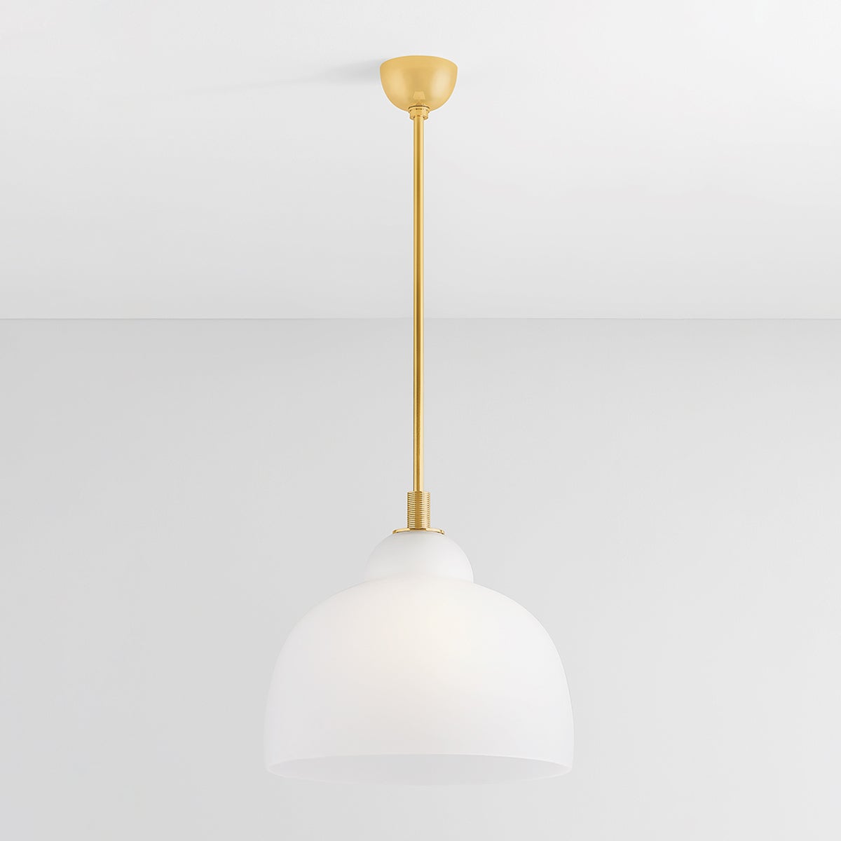 Oberon Pendant 18" in aged brass shown from the front to reveal the shade shape and metal detail.
