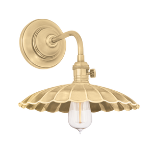 Heirloom Wall Sconce in Aged Brass shown from a second angle to highlight the arm curve and shade silhouette.
