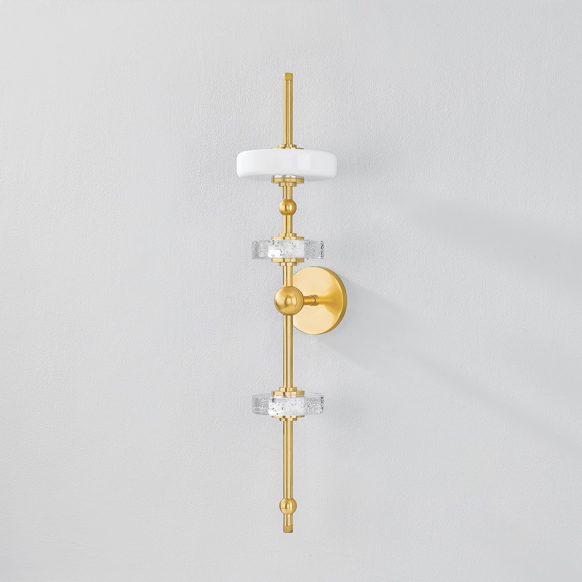 Maynard Wall Sconce in aged brass shown from a second angle to highlight the arm curve and shade silhouette.