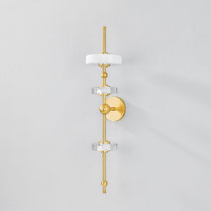 Maynard Wall Sconce in aged brass shown from a second angle to highlight the arm curve and shade silhouette.