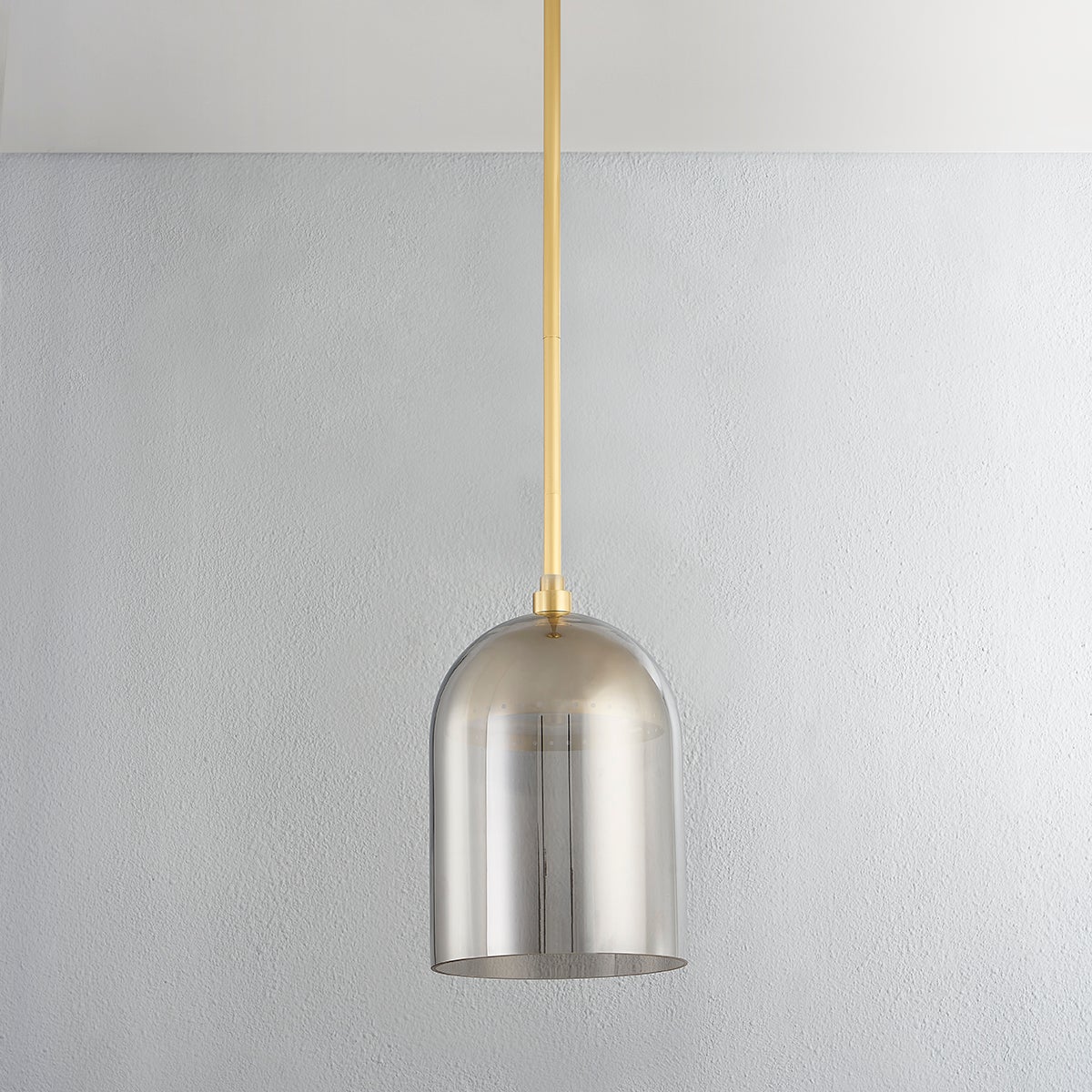 Dorval Pendant 9" in aged brass shown from a second angle to highlight the shade shape and metal detail.