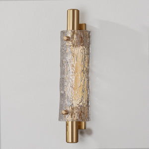 Harwich Wall Sconce 3.5" x 18" in aged brass shown from the front to reveal the arm curve and shade silhouette.