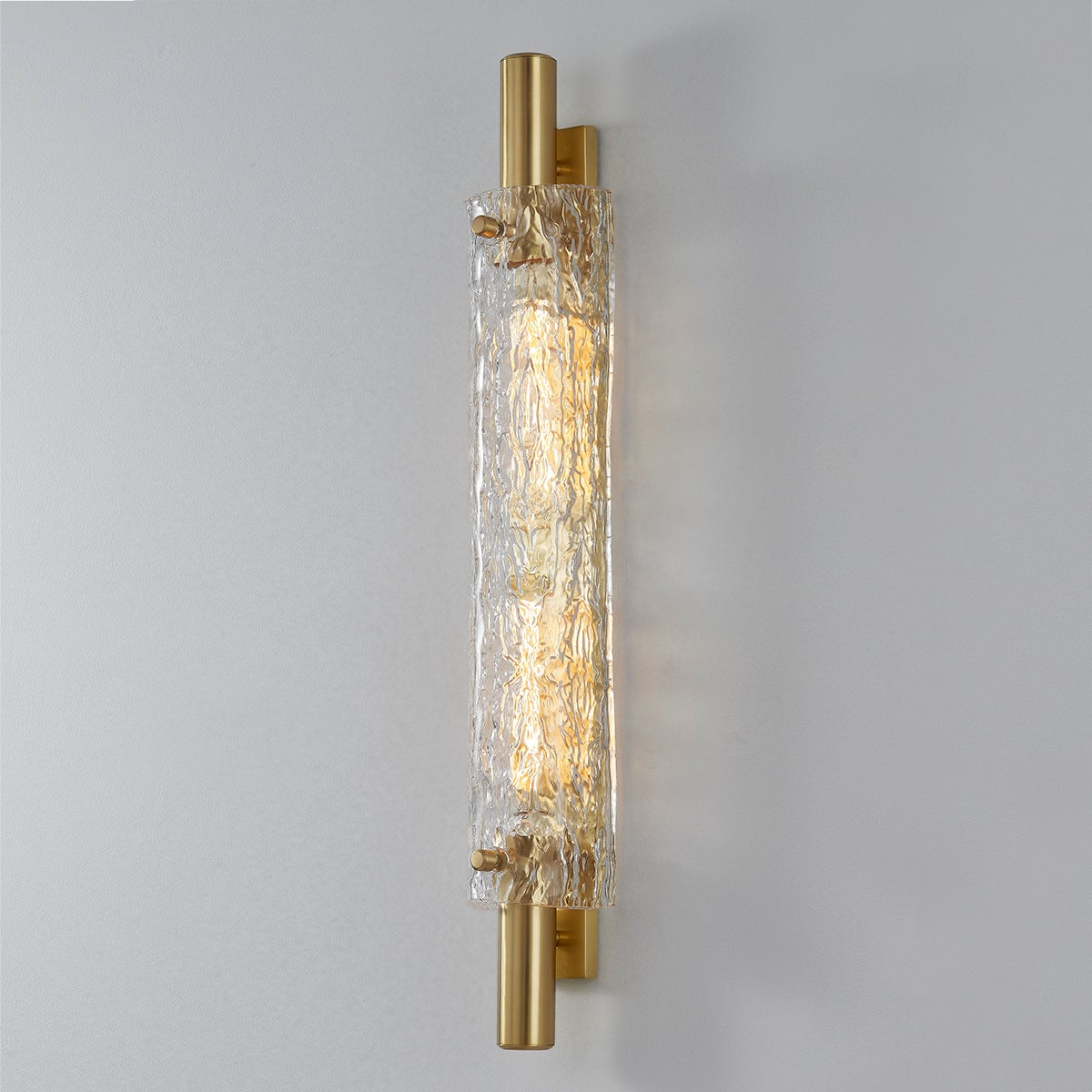 Close-up of the Harwich Wall Sconce 3.5" x 28.75" in aged brass showing the arm curve and shade silhouette.