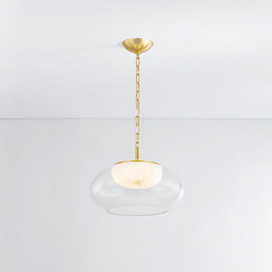 Close-up of the Moore Pendant 17" in aged brass showing the shade shape and metal detail.