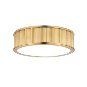 Middlebury Flush Mount 13" x 3.75" in aged brass shown from the front to reveal the shade profile and mounting canopy.