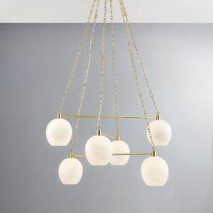 Close-up of the Asbury Park Chandelier 38" in aged brass showing the frame, arms, and shade detail.